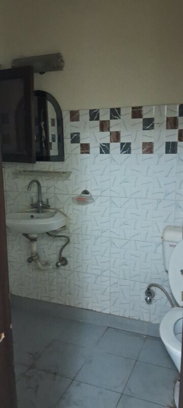 Bathroom in 2.5 BHK Apartment at Sarita Vihar – for Rent