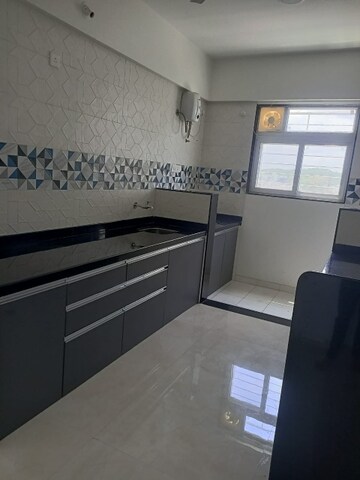 Kitchen in 2 BHK Apartment at Ruparel Jewel, Parel – for Rent