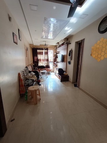Living Room in 1 BHK Apartment at Lodha Palava Crown, Dombivli East – for Sale