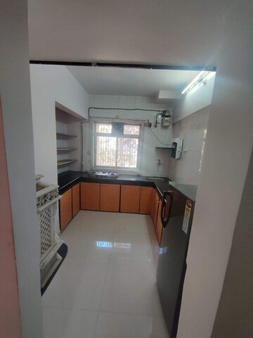 Kitchen in 2 BHK Apartment at Shubharambh Complex, Manpada – for Rent