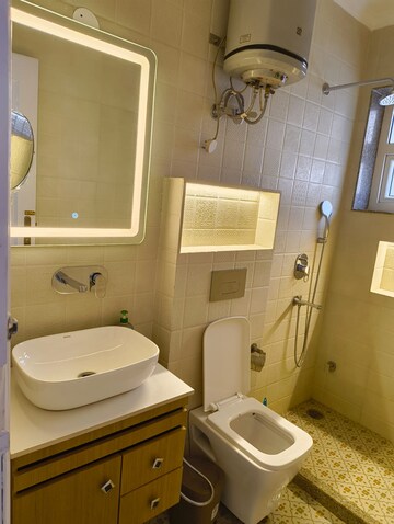 Bathroom in 4 BHK Apartment at Geetanjali Enclave – for Rent