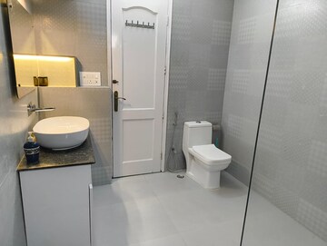 Bathroom in 4 BHK Apartment at Geetanjali Enclave – for Rent