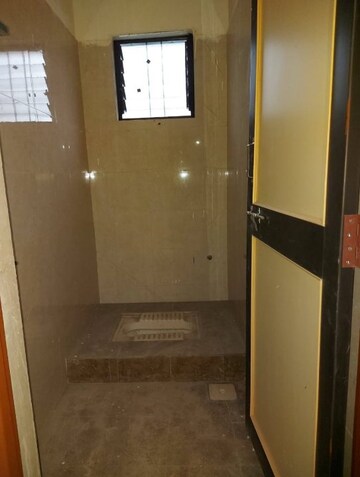 Bathroom in 1 RK Apartment at Royal Ishana, Thergaon – for Rent