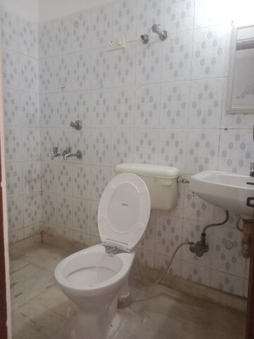 Bathroom in 1 BHK Apartment at RWA Qutab Enclave, Katwaria Sarai – for Rent
