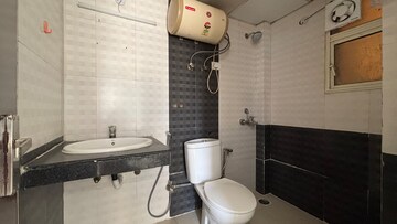 Bathroom in 2.5 BHK Apartment at Gaur City 5th Avenue, Sector 4 Greater Noida – for Rent