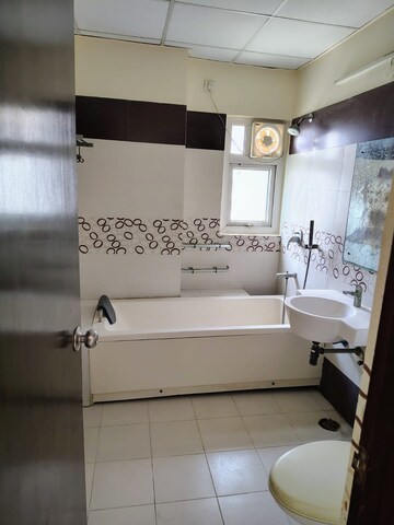 Bathroom in 4 BHK Apartment at Mahagun Mezzaria, Sector 78 – for Rent