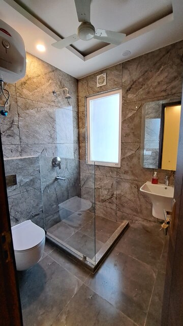 Bathroom in 4 BHK Builder Floor at Ansal Sushant Lok I, Sector 43 – for Rent