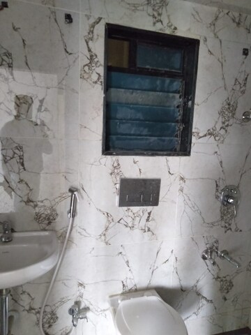 Bathroom in 1 BHK Apartment at RNA NG Canary, Mira Road – for Sale