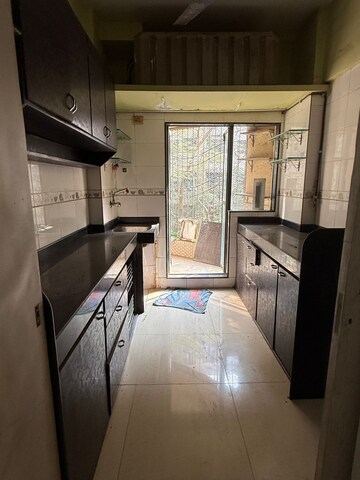 Kitchen in 2 BHK Apartment at New Shree Avenue Complex, Mira Road – for Sale
