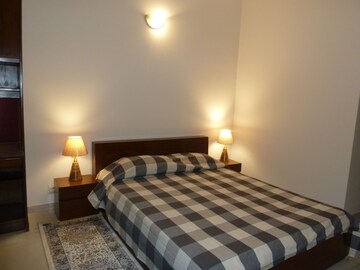 Bedroom in 3 BHK Apartment at Boutique Residential Apartments C-253, Defence Colony – for Rent