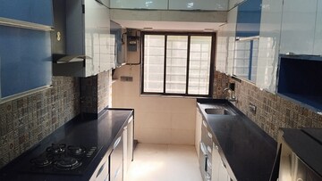 Kitchen in 2 BHK Apartment at Evershine Grandeur, Malad West – for Rent