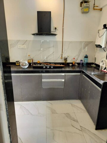 Kitchen in 2 BHK Apartment at Dev Leo Tower, Oshiwara – for Rent