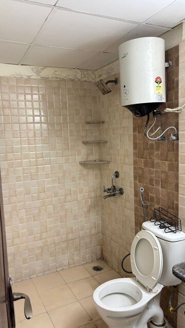 Bathroom in 2 BHK Apartment at Aims Golf City, Sector 75 – for Rent