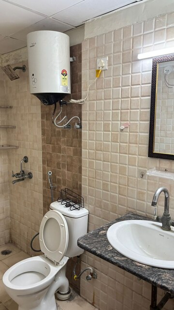 Bathroom in 2 BHK Apartment at Aims Golf City, Sector 75 – for Rent