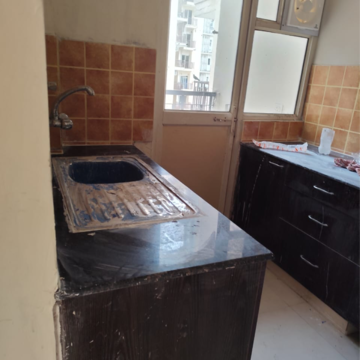 Kitchen in 3 BHK Apartment at Gardenia Golf City, Noida Central – for Rent