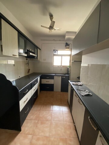 Kitchen in 2.5 BHK Apartment at Runwal Garden City, Balkum Pada – for Rent
