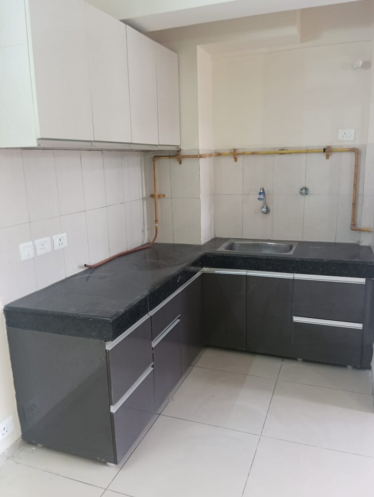 Kitchen, wave-executive-floors 2 Bedroom 900 Sq.Ft. Apartment In Wave City Ghaziabad 8670545