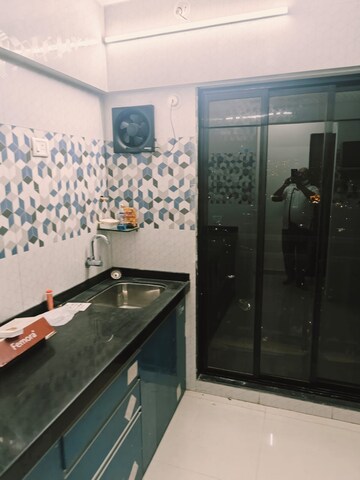 Kitchen in 1 BHK Apartment at Raunak Unnathi Woods Phase 7 A And B, Ghodbunder Road – for Rent