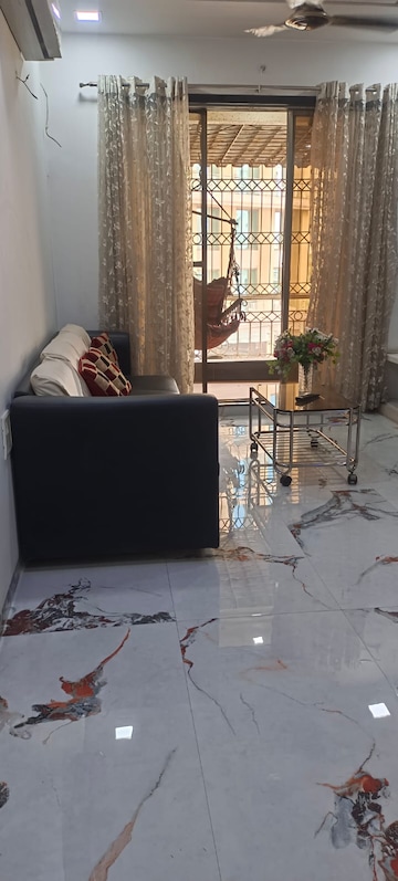 Living Room in 2 BHK Apartment at Ravechi Heights, Kharghar – for Sale