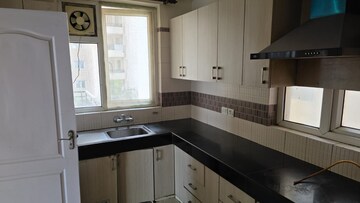 Kitchen in 3.5 BHK Apartment at Orchid Petals, Sector 49 – for Rent