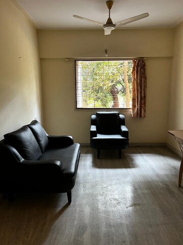 Living Room in 2 BHK Apartment at Crystal Garden Estate CHS, Manpada – for Sale