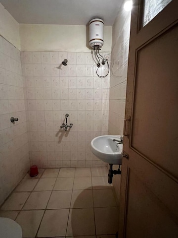 Bathroom in 2 BHK Apartment at Crystal Garden Estate CHS, Manpada – for Sale