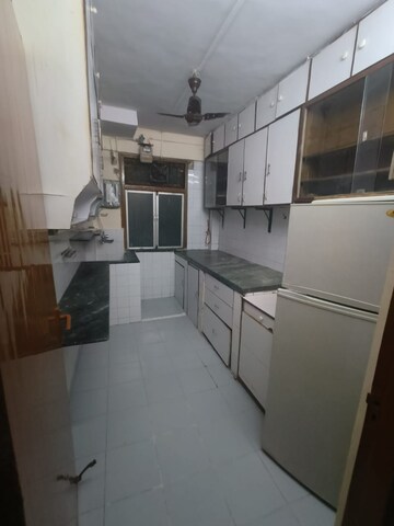 Kitchen in 1 BHK Apartment at Manish Garden CHS, Andheri West – for Rent