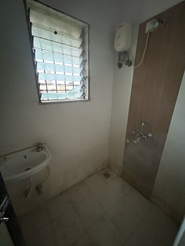 Bathroom in 1 BHK Apartment at Raunak Unnathi Woods Supreme, Kasarvadavali – for Rent