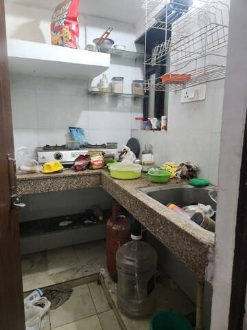 Kitchen in 2 BHK Apartment at RWA Qutab Enclave, Katwaria Sarai – for Rent