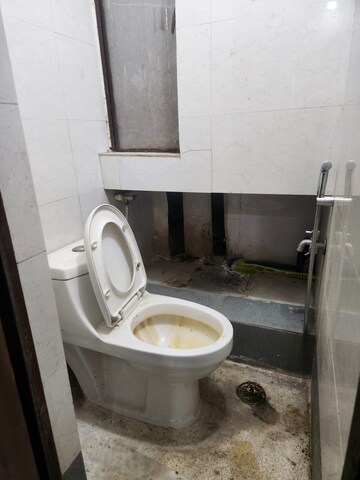 Bathroom in 2 BHK Apartment at RWA Qutab Enclave, Katwaria Sarai – for Rent