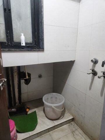 Bathroom in 2 BHK Apartment at RWA Qutab Enclave, Katwaria Sarai – for Rent