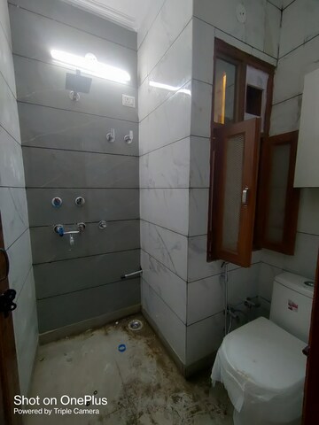 Bathroom in 1.5 BHK Builder Floor at Dwarka Mor – for Rent