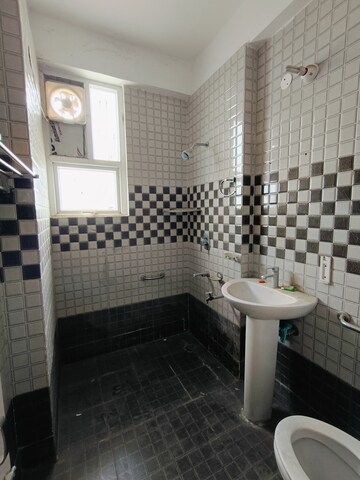 Bathroom in 3 BHK Apartment at Sunny Enclave – for Rent