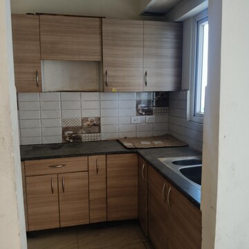 Kitchen in 2 BHK Apartment at Gaur 14th Avenue High Street, Sector 16c Greater Noida – for Rent