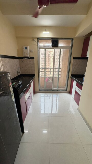 Kitchen in 1 BHK Apartment at Velocity Hill Spring, Ghodbunder Road – for Rent