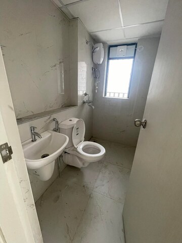 Bathroom in 1 BHK Apartment at Runwal Gardens, Dombivli East – for Rent