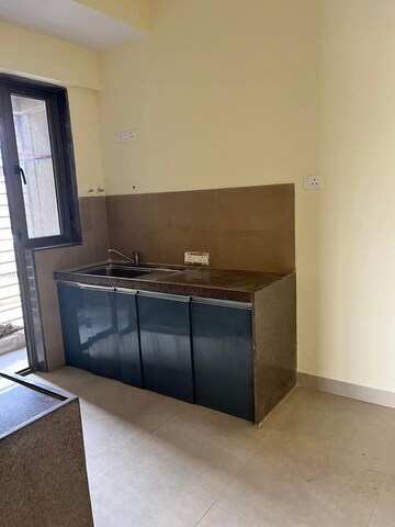 Kitchen in 2.5 BHK Apartment at Bhimjyani Verraton, Manpada – for Rent