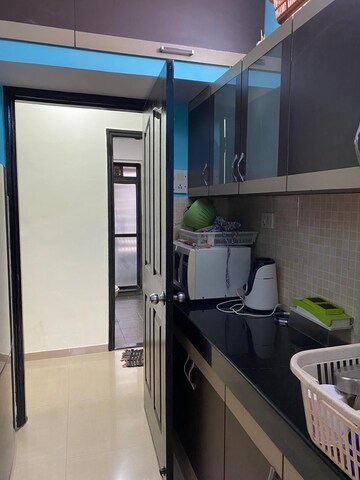 Kitchen in 2 BHK Apartment at Lalani Residency, Kavesar – for Rent