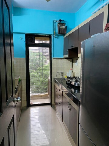 Kitchen in 2 BHK Apartment at Lalani Residency, Kavesar – for Rent