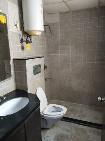 Bathroom in 2 BHK Apartment at Eros Kenwood Tower, Charmwood Village – for Rent
