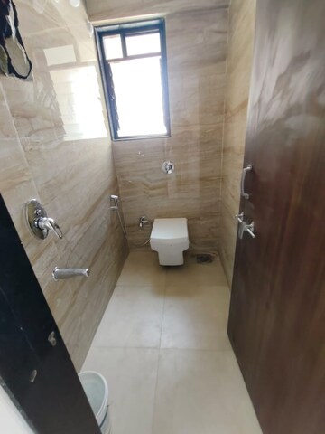 Bathroom in 2 BHK Apartment at Ravetkar Arihant Shree, Dahanukar Colony – for Rent