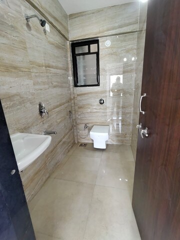 Bathroom in 2 BHK Apartment at Ravetkar Arihant Shree, Dahanukar Colony – for Rent