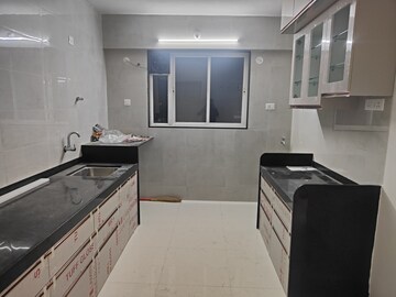 Kitchen in 2 BHK Apartment at Ravetkar Arihant Shree, Dahanukar Colony – for Rent