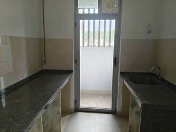 Kitchen in 1 BHK Apartment at Piramal Revanta Ravin, Mulund West – for Sale