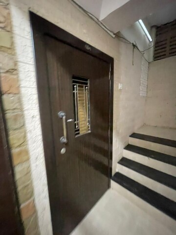 Staircase in 2 BHK Apartment at Express Apartment, Yari Road – for Rent