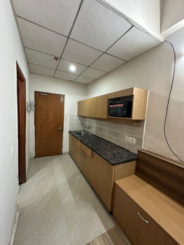 Kitchen in 1 BHK Apartment at Paramount Golfforeste Villas, Zeta I Greater Noida – for Rent