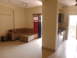 Living Room in 2 BHK Apartment at Aims Golf City, Sector 75 – for Sale