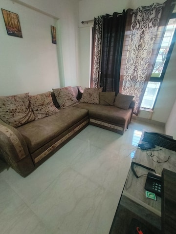 Living Room in 1 BHK Apartment at Lodha Palava Crown, Dombivli East – for Rent