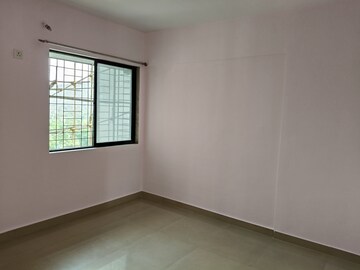 Room in 2 BHK Apartment at Pushpanjali Heights, Owale – for Sale