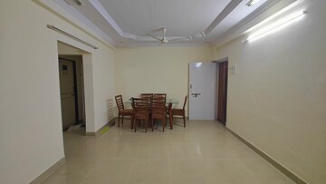 Living Room in 2 BHK Apartment at Abhinandan CHS, Borivali West – for Rent